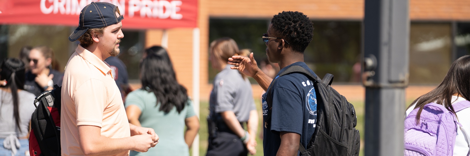 Photo of students talking at Big Red Blowout.