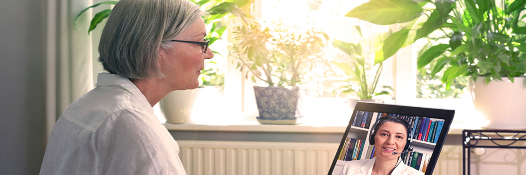 Photo of woman on telehealth call.